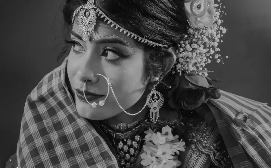 Black and white portrait of a bride in traditional jewellery
